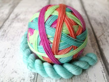 Load image into Gallery viewer, Silver Sparkle Self Striping Yarn in Summer Dream colourway with a coordinating mini skein