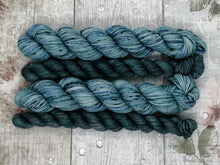 Load image into Gallery viewer, Silver Sparkle 4ply 50g in the In The Deep colourway with a coordinating mini skein