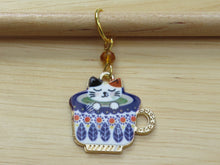 Load image into Gallery viewer, Sleepy cat in a teacup Stitch Marker / Progress Keeper