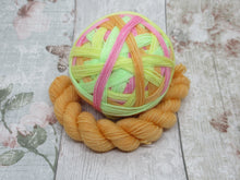 Load image into Gallery viewer, Silver Sparkle Self Striping Yarn in Lolly colourway with a coordinating mini skein