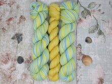 Load image into Gallery viewer, Silver Sparkle Self Striping Yarn in Life's A Beach colourway with a coordinating mini skein