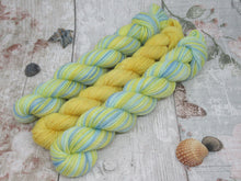 Load image into Gallery viewer, Silver Sparkle Self Striping Yarn in Life's A Beach colourway with a coordinating mini skein