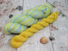 Load image into Gallery viewer, Silver Sparkle Self Striping Yarn in Life's A Beach colourway with a coordinating mini skein