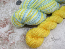Load image into Gallery viewer, Silver Sparkle Self Striping Yarn in Life's A Beach colourway with a coordinating mini skein