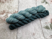 Load image into Gallery viewer, Deluxe Merino Nylon 4ply 50g in the In The Deep colourway with a coordinating mini skein