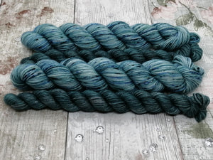 Silver Sparkle 4ply 50g in the In The Deep colourway with a coordinating mini skein