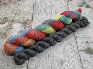 Silver Sparkle 4ply 50g in Rainbow colourway with a mini in Stormcloud