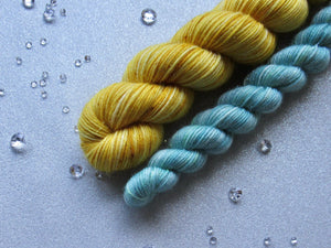 Silver Sparkle 4ply 50g in Christmas In July colourway Gold with a mini skein in Sage Green