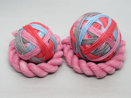 Deluxe Merino Nylon Self Striping Yarn in the Rocking Robin colourway with a coordinating mini skein
