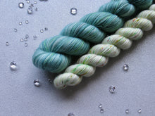 Load image into Gallery viewer, Silver Sparkle 4ply 50g in Christmas In July colourway Sage with a Speckled mini skein in