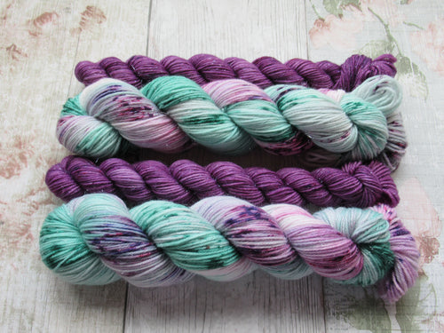Silver Sparkle 4ply 50g in Sea Glass colourway with a purple speckled mini skein