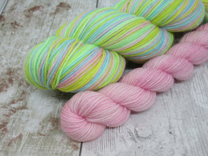 Silver Sparkle Self Striping Yarn in If You're Happy and You Know It colourway with a coordinating mini skein