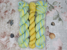 Load image into Gallery viewer, Silver Sparkle Self Striping Yarn in Life&#39;s A Beach colourway with a coordinating mini skein