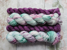 Load image into Gallery viewer, Deluxe Merino Nylon 4ply 50g in Sea Glass colourway with a purple speckled mini skein