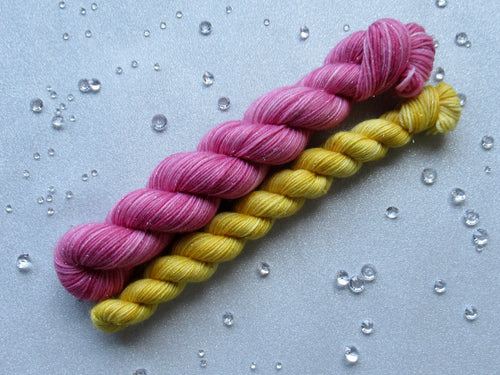 Silver Sparkle 4ply 50g in Christmas In July colourway Deep Pink with a mini skein in Gold