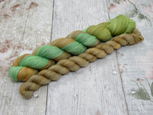 Load image into Gallery viewer, Silver Sparkle 4ply 50g in Kicking Leaves colourway with a matching mini skein