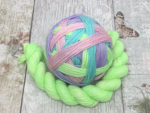 Deluxe Merino Nylon Self Striping Yarn in 'Feelings of Spring' colourway with a coordinating mini skein