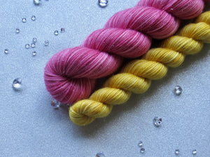 Silver Sparkle 4ply 50g in Christmas In July colourway Deep Pink with a mini skein in Gold