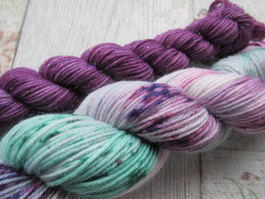 Silver Sparkle 4ply 50g in Sea Glass colourway with a purple speckled mini skein